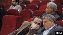 Mohsen Hashemi, Chairman of Tehran City Council, and Mojtaba Rahmanzadeh, Mayor of District 13 of Tehran who has been diagnosed with coronavirus speaking at a meeting of the Council on February 18. 