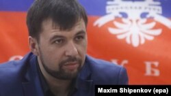 Denis Pushilin, Member of Donetsk People's Republic government attend a press conference at the regional administration building in Donetsk, Ukraine