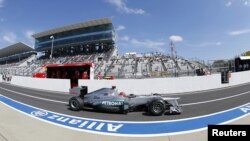 Japan -- Mercedes Formula One driver Michael Schumacher of Germany drives in the pit lane during the first practice session of the Japanese F1 Grand Prix at the Suzuka circuit, 05Oct2012