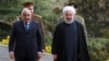 Iranian President Hassan Rouhani (right) receives Iraqi Prime Minister Adel Abdel Mahdi in Tehran on April 6. 