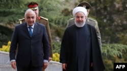 Iranian President Hassan Rouhani (right) receives Iraqi Prime Minister Adel Abdel Mahdi in Tehran on April 6. 