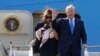 President Donald Trump waves and he and first lady Melania Trump arrive at Stansted Airport in England, Monday, June 3, 2019 at the start of a three day state visit to Britain.