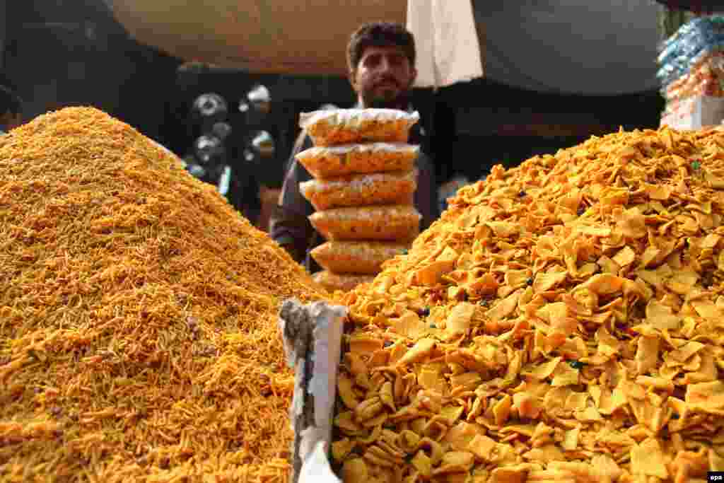 An Afghan vendor in Jalalabad on October 10 sells traditional food as Muslims across the world prepare for the holy festival of Eid al-Adha. (epa/Abdul Mueed)