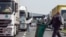 Serbia - Truck drivers wait on a highway to cross the Serbian border in Bajakovo, Croatia, 24Sep2015.