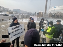 Zhanbolat Mamai demonstrates in Almaty on January 15.