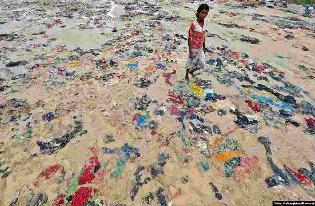 Discarded items of clothing lie strewn on the ground in a Rohingya refugee camp in Cox&#39;s Bazar, Bangladesh. (Reuters/Cathal McNaughton)