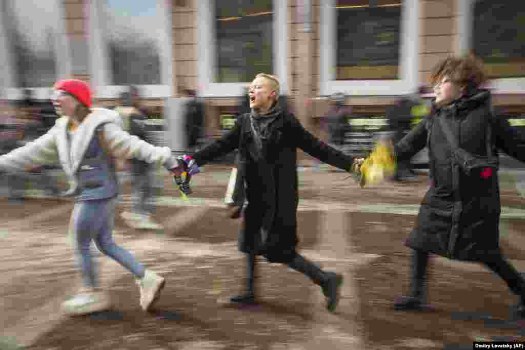 Russian feminists dance at an event to mark International Women&#39;s Day in St. Petersburg on March 8. (AP/Dmitry Lovetsky)