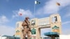 FILE: A Pakistani soldier stands guard at the border crossing between Afghanistan and Pakistan in Chaman.