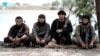 The defection to Islamic State of former Tajik special-forces commander Gulmorod Halimov (second from right) may be one of the reasons why so many of his compatriots have become suicide bombers for the extremist group. (file photo)