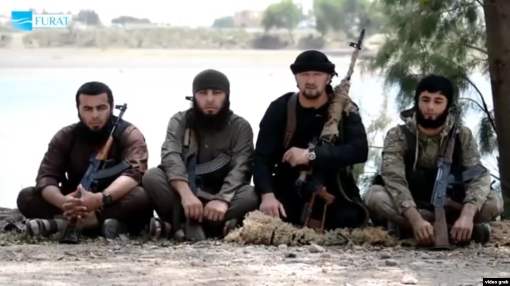 The defection to Islamic State of former Tajik special-forces commander Gulmorod Halimov (second from right) may be one of the reasons why so many of his compatriots have become suicide bombers for the extremist group. (file photo)