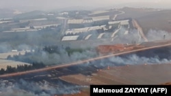 This picture taken on September 1, 2019 from a location near the southern Lebanese village of Maroun al-Ras, close to the border with Israel, shows smoke rising from fires along the border with Israel on the Lebanese side following an exchange of fire.