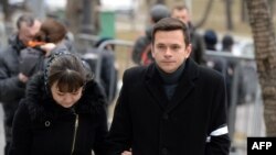 Russian opposition activist Ilya Yashin (right) arrives to attend a farewell ceremony for Nemtsov in Moscow on March 3.