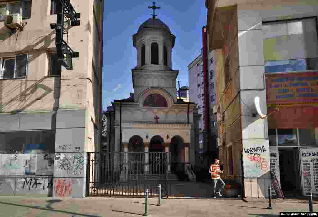 St. John the New Orthodox Church in Bucharest on October 30, 2017, nestled between modern buildings.