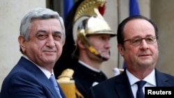 France -- Armenian President Serzh Sarkisian (L) is greeted by French President Francois Hollande upon his arrival at the Elysee Palace in Paris, March 8, 2017