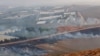 This picture taken on September 1, 2019 from a location near the southern Lebanese village of Maroun al-Ras, close to the border with Israel, shows smoke rising from fires along the border with Israel on the Lebanese side following an exchange of fire.