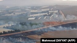 This picture taken on September 1, 2019 from a location in southern Lebanon near border with Israel, shows smoke rising from fires along the border with Israel on the Lebanese side following an exchange of fire.