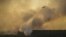 A plane drops water as Ukrainian firefighters fight a fire in the vicinity of Chernobyl in 2015.