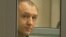 Eston Kohver is shown in a defendants' cage during a court hearing in Pskov, Russia, on June 2.