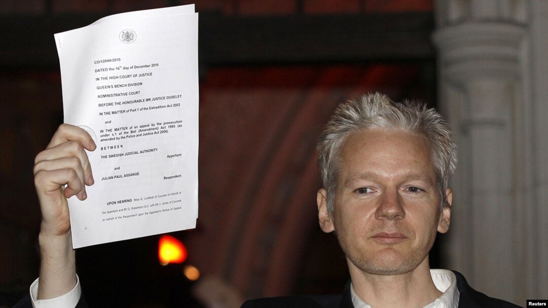 WikiLeaks founder Julian Assange emerges from a London courtroom after being released from prison on bail.