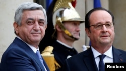 France -- Armenian President Serzh Sarkisian (L) is greeted by French President Francois Hollande upon his arrival at the Elysee Palace in Paris, March 8, 2017