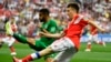 Russian midfielder Aleksandr Golovin (right) and Saudi Arabian defender Muhammad Al-Breik vie for the ball during their opening World Cup match, which Russia won 5-0 on June 14. 