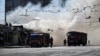 Firefighters work at the site of a recent Russian missile strike in Zaporizhzhya.