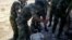 A video shows what is described by antiregime activists as the torture by government forces of a "martyr" named Louai al-Amer in Houla in Homs last year.