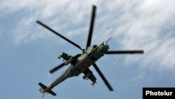 An Armenian Mi-24 combat helicopter flies near Yerevan. (file photo)