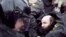 Russian Interior Ministry officers detain opposition activists in Moscow on March 31.