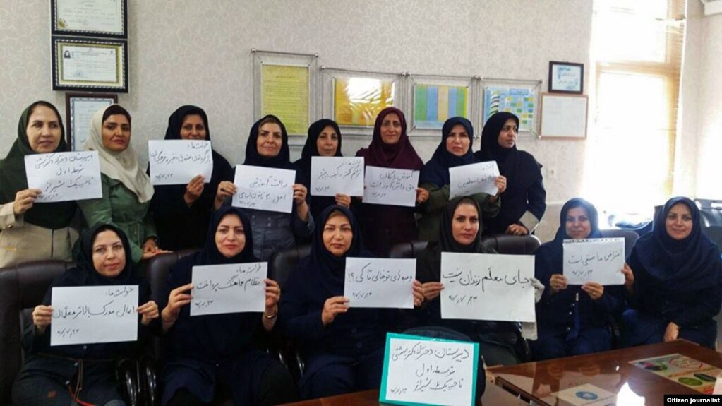 Iranian teachers in many parts of the country refused to go to their classes for the second day in a row, in protest to their situation on Monday, October 15, 2018. One placard says: "A teacher's place is not in prison".