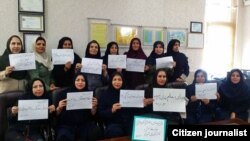 Iranian teachers in many parts of the country refused to go to their classes for the second day in a row, in protest to their situation on Monday, October 15, 2018. One placard says: "A teacher's place is not in prison".