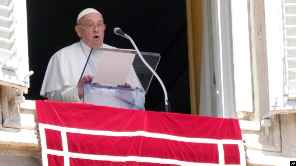 Pope Francis delivers the noon prayer on St. Peter's Square at the Vatican on August 25.