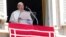 Pope Francis delivers the noon prayer on St. Peter's Square at the Vatican on August 25.