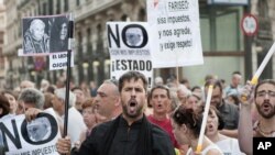 Demonstrators in Spain protest against the visit of Pope Benedict XVI in Madrid.