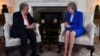 Britain's Prime Minister Theresa May (R) talks with United Nations Secretary-General, Antonio Guterres, during their meeting inside 10 Downing Street in central London on May 2, 2018