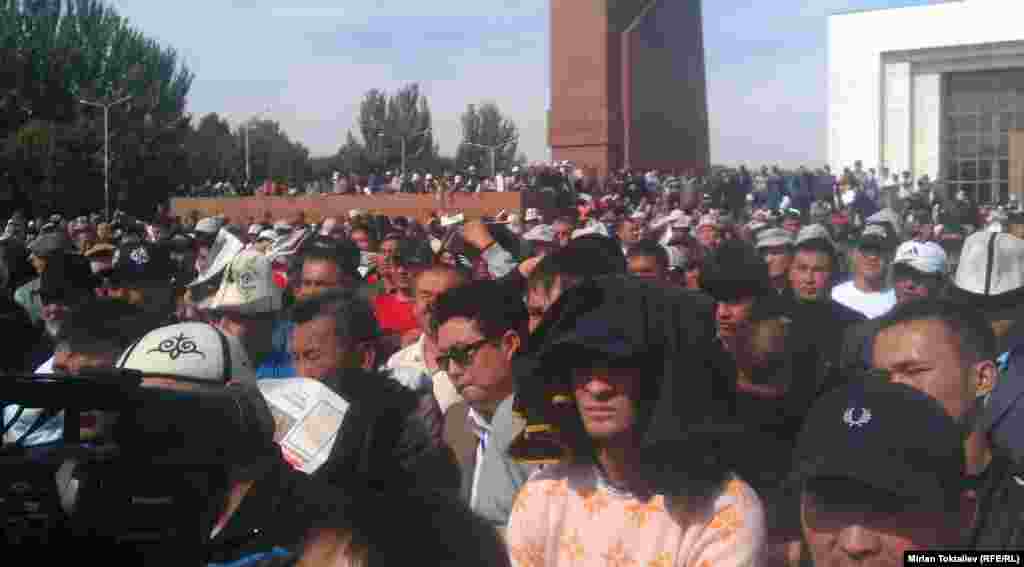 Hundreds of people gather for a rally against the Kumtor gold mine outside the parliament building in Bishkek on October 3.