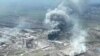 Smoke rises above the Azovstal steelworks in Mariupol in this still image obtained from a recent drone video posted on social media. Ukrainian Foreign Minister Dmytro Kuleba said the port city of Mariupol effectively doesn’t exist anymore because of the massive destruction by relentless bombardment.