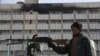 AFGHANISTAN -- An Afghan police officer stands guard in front of the Intercontinental Hotel in Kabul, January 23, 2018