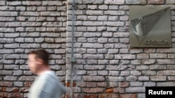 A man walks past a Sputnik Serbia sign near the company's office in Belgrade (file photo).