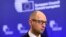 Ukrainian Prime Minister Arseniy Yatsenyuk told EU leaders in Brussels that Moscow was aiming to divide them. 