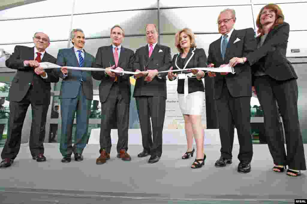 Cutting the ribbon at the grand opening ceremony.