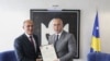 Fired Interior Minister Bejtush Gashi (left) pictured with Kosovo's prime minister in April.