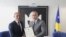 Fired Interior Minister Bejtush Gashi (left) pictured with Kosovo's prime minister in April.