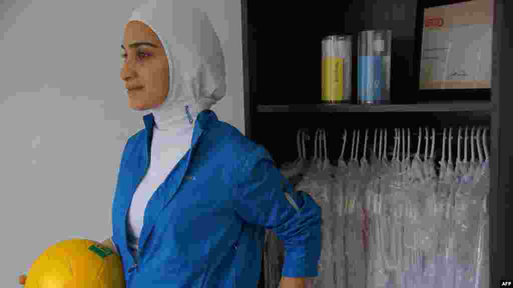 The "sport hijab" was created by a young Canadian designer, Elham Seyed Javad, who models it in Montreal in April 2011.