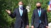 Romanian President Klaus Iohannis (right talks with his Polish counterpart, Andrzej Duda, (Right) in Bucharest on May 10. 