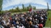 Armenia - People walk to the Tsitsernakabert memorial in Yerevan to mark the 99th anniversary of the Armenian genocide in Ottoman Turkey, 24Apr2014.