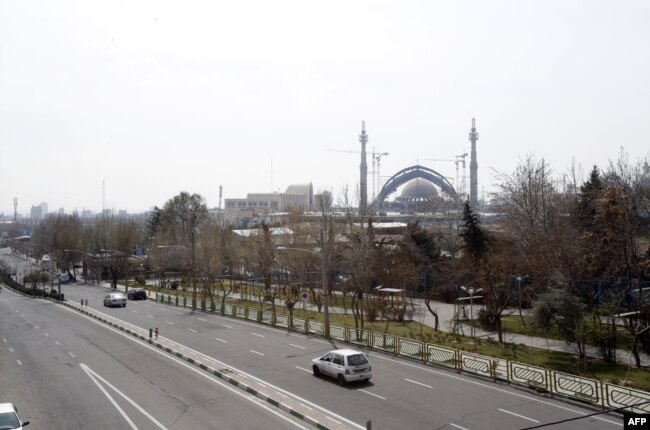A photo shows an almost emply road in Tehran on March 13.