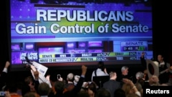 Republican supporters cheer as a giant TV screen displays the results of the Senate race in the U.S. midterm elections in Denver, Colorado, on November 4.