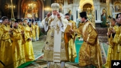 Russian Orthodox Patriarch Kirill (center) delivers a Christmas service in Christ the Saviour Cathedral in Moscow on January 6, the evening before Orthodox Christmas. 