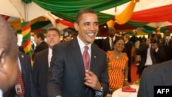 U.S. President Barack Obama greets residents during breakfast at the Presidential Castle in Accra.